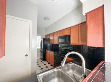 Plenty of cabinet and counter space for cooking. D