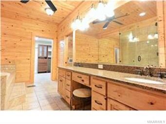 The bathroom vanity has lots of storage space.