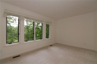 Living room with light, bright windows-view of gol