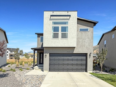View of front of house with a garage, stucco siding, a standing seam roof, a metal roof, and concrete driveway