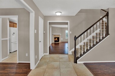 Inviting entry with open living area that works well as a gathering area or home office.