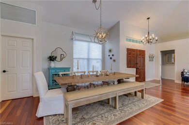 Dining area just off the kitchen with wood floors 
