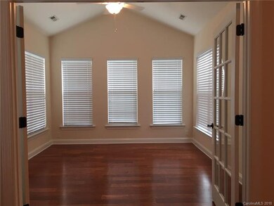 Vaulted Sunroom with French Doors.