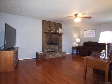 Living Room has a brick fireplace with gas logs.