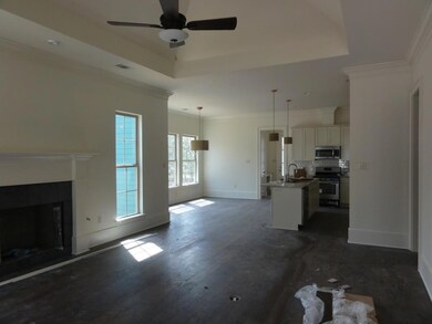 Spacious living room with wood floors, fireplace f