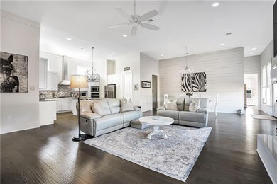 Beautiful living area with shiplap on dining room 