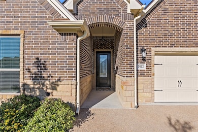 Entrance to property with brick siding