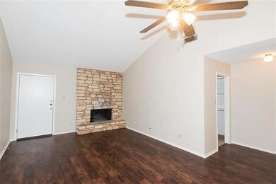 Unfurnished living room featuring a ceiling fan, 