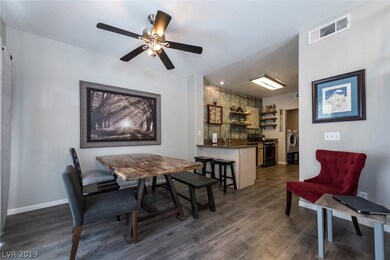 OPEN KITCHEN/ DINING AREA W/ SOLID SURFACE FLOORIN