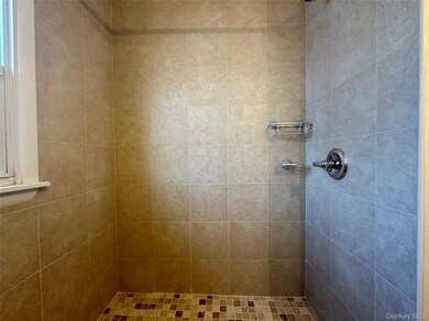 Bathroom with tiled shower