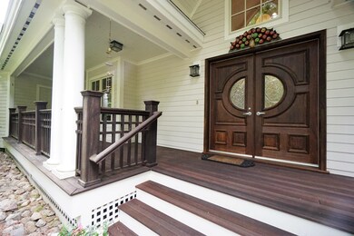 The porch also has a door that leads to the garage