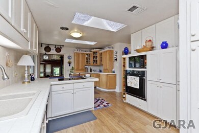 Built-in Oven, Wine Rack and Cabinetry galore.