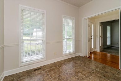 Spare room with dark hardwood / wood-style floors 
