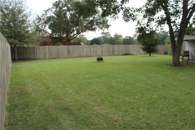 Backyard has several fruit and pecan trees