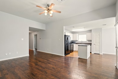 Alternate view looking towards the kitchen and liv