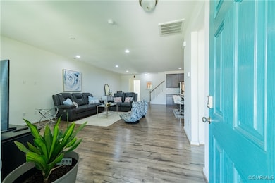 Entryway featuring wood finished floors, recessed
