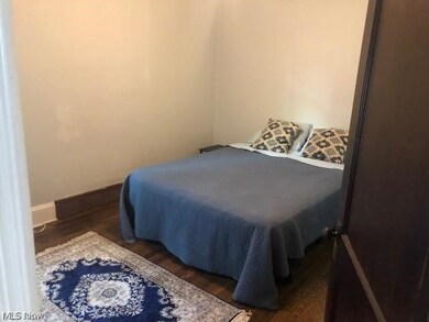 Bedroom featuring dark hardwood / wood-style flooring