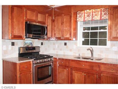 Kitchen - Under mount sink and solid wood cabinets