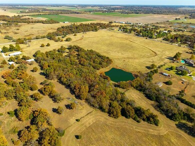 west View of property location featuring a large body of water and rural landscape