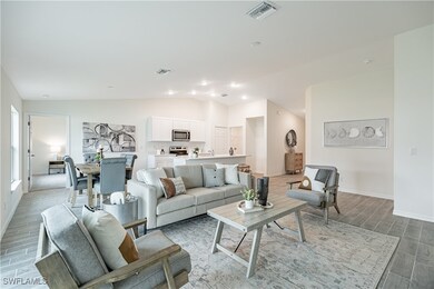 Living room featuring lofted ceiling, visible vent