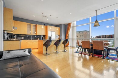 Kitchen with stainless steel appliances, light br