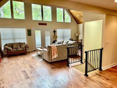 Living area featuring baseboards, wood finished fl