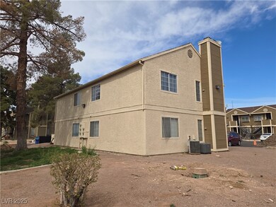 View of side of property featuring stucco siding,
