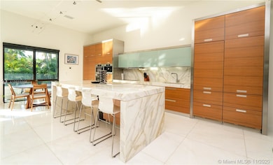 OPULENT CALCUTTA MARBLE ISLAND AND COUNTER WITH LO