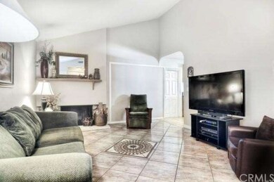 Living room with fireplace and tile flooring
