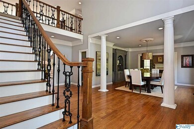 Showcases Beautiful Hardwoods, Mouldings & Iron Work on Banisters