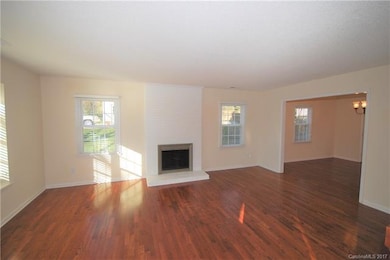 LIVING ROOM: Wood-burning Fireplace w/ Floor to Ce