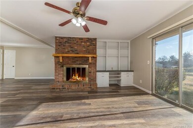 Keeping Room with wood burning fireplace.  Sliding