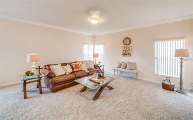 Large family room with new carpet, ceiling fans an