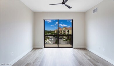 Empty room featuring visible vents, ceiling fan, w
