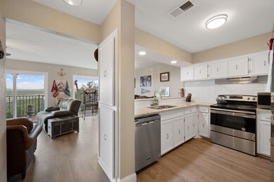 Kitchen with stainless steel appliances, open flo