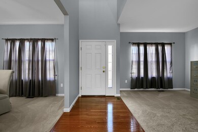 Hardwood Entry Foyer with a 2 story Ceiling Height