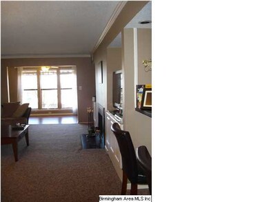View from dining area into living room and sunroom