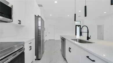 Kitchen featuring a sink, appliances with stainles