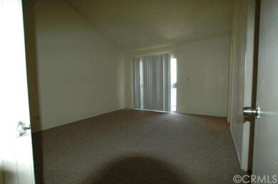 Master Suite with Vaulted Ceiling and Sliding Door to Balcony to View Mountains and City Lights.
