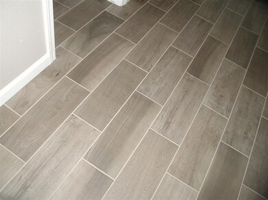 Top of the line, Wood plank tile flooring! This wa