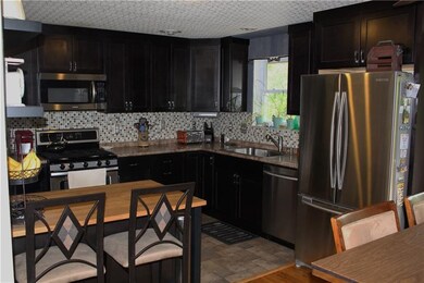 Open kitchen with stainless steel appliances