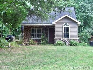 Quiet setting for this quaint home in the woods