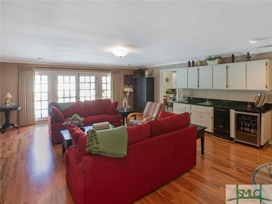 Family room including built-ins, ice maker, Wine c