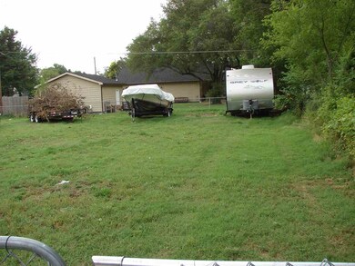 Large fenced yard big enough for multiple trailers