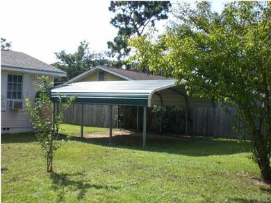 Additional covered parking in the rear yard.