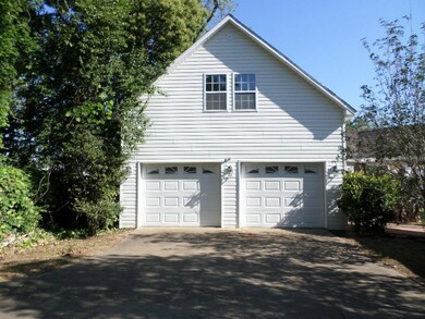 Two Car Garage With Un Finished Room Upstairs
