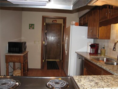 Laundry, storage and garage past the kitchen