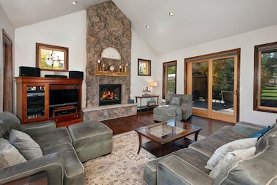 Living room with high vaulted ceiling, healthy amo