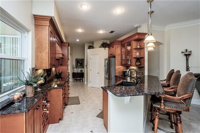 Kitchen Features Wood Cabinetry & Granite Counters
