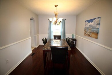 The dining room features chair rail molding.